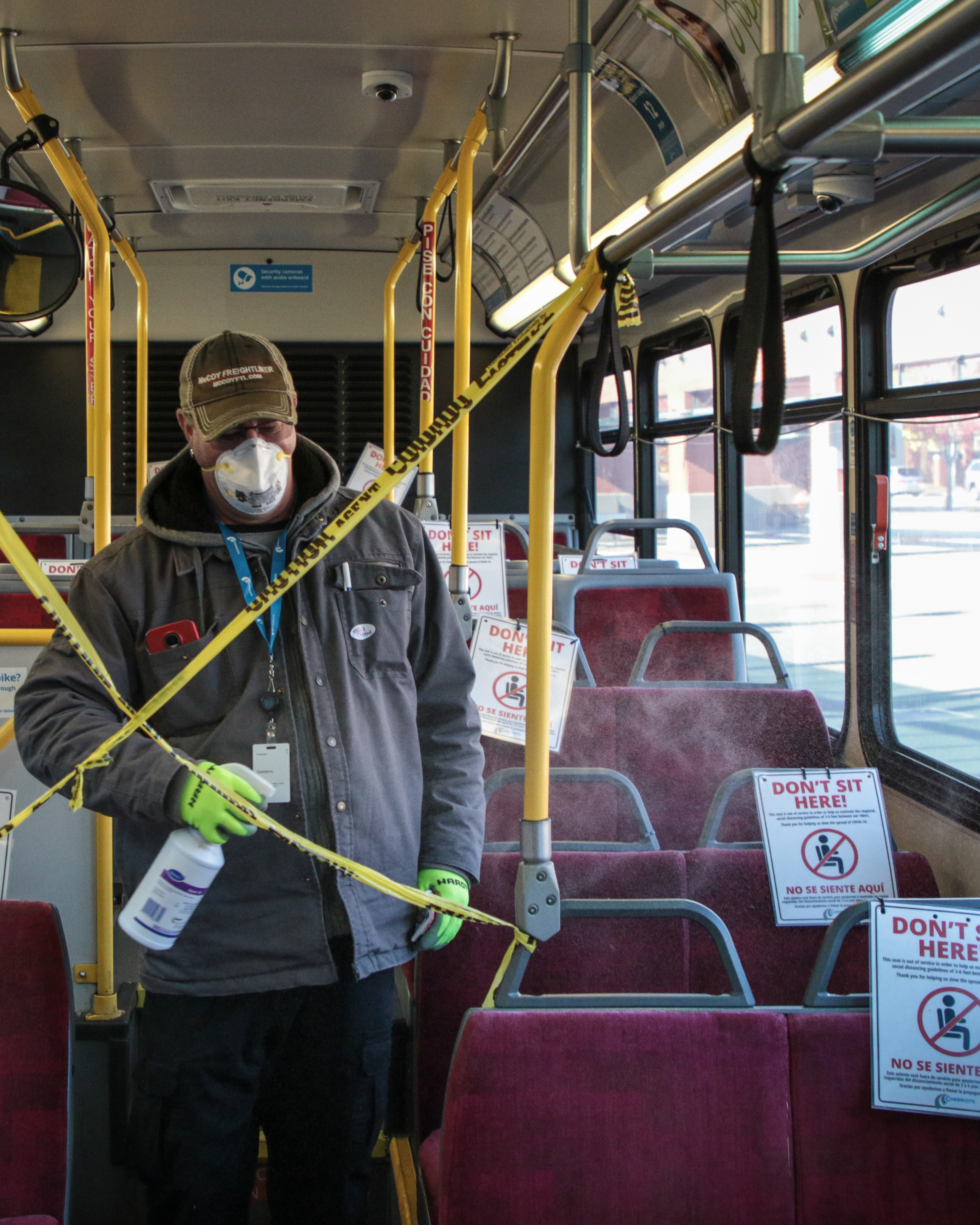 Facilities Maintenance Worker Cleaning the Bus